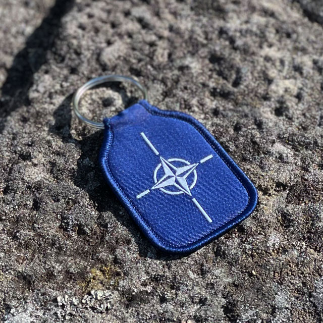 A Keyring NATO from TAC-UP GEAR on a stony background