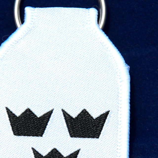 Close up of a Keyring White With Crowns.