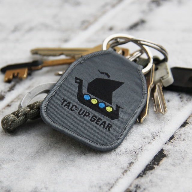 A M90 Keyring TUG with keys on frosty background.