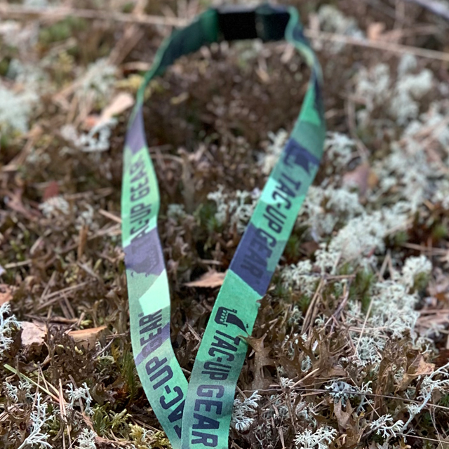 M90 Neck Lanyard in and out f focus on moss