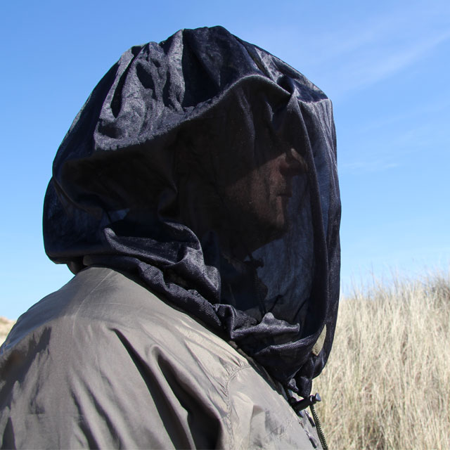 Side view of a model draped over head with a Mosquito Head Net Black/M90