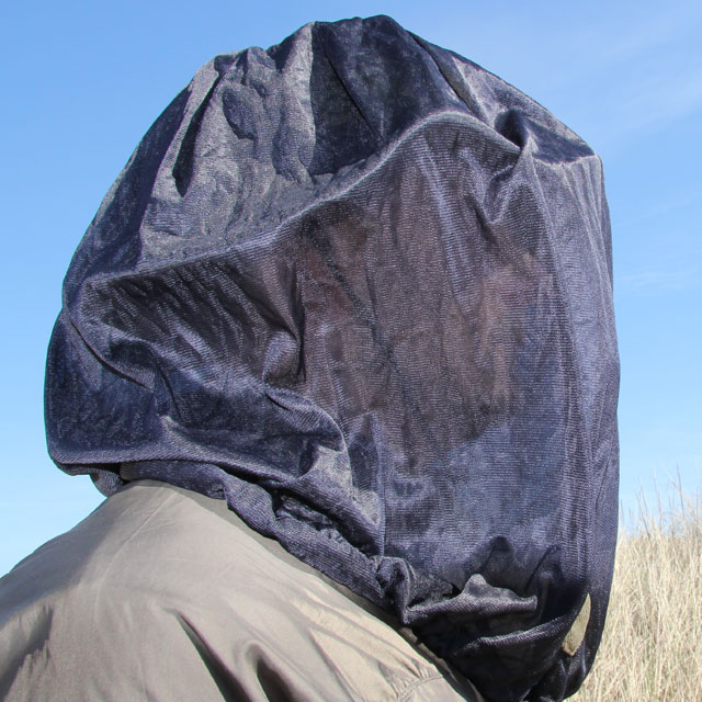 Mosquito Head Net Black/M90 draped over head, face barley visible