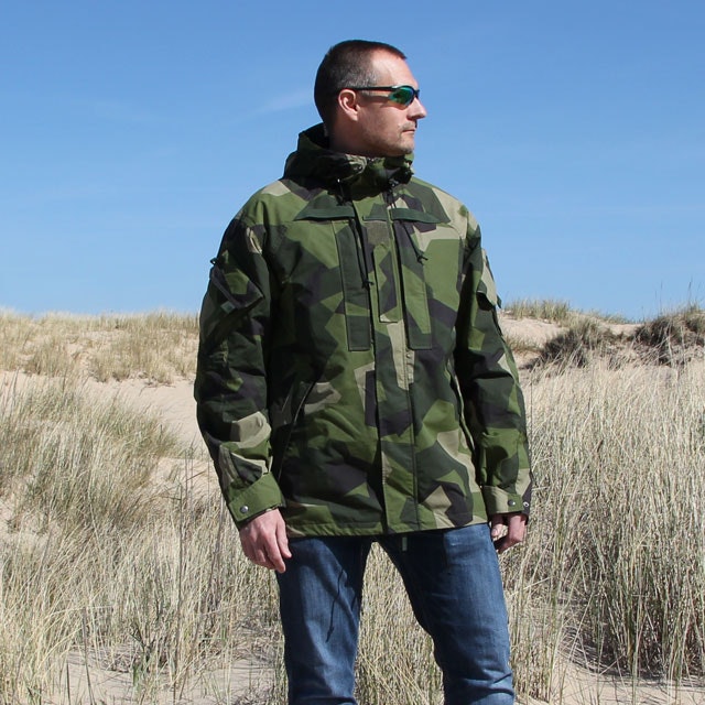 Slightly sideways here shown the NCWR Jacket M90 Gen 2 on a sunny beach