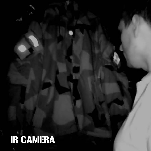IR Camera photo in dark room showing clearly reflective IR patches mounted on NCWR Jacket