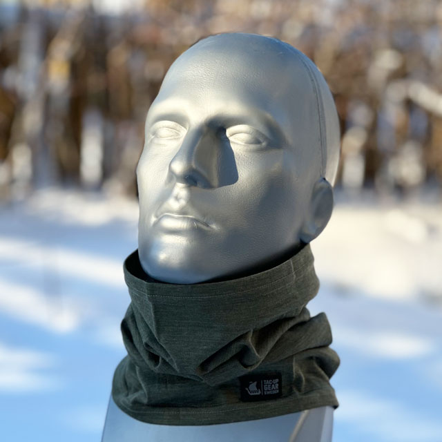 A Neck Tube Merino Wool Green from TAC-UP GEAR seen around neck on a model