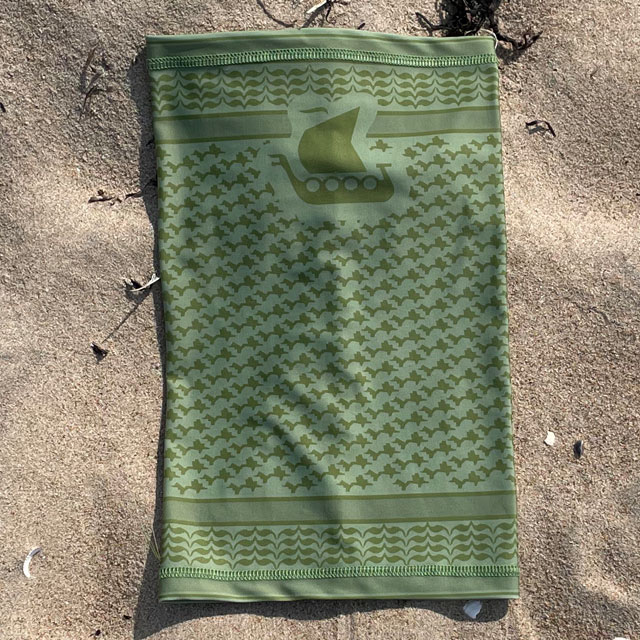 Neck Tube Shemagh Lime Green from TAC-UP GEAR lying flat on sand and seen from above