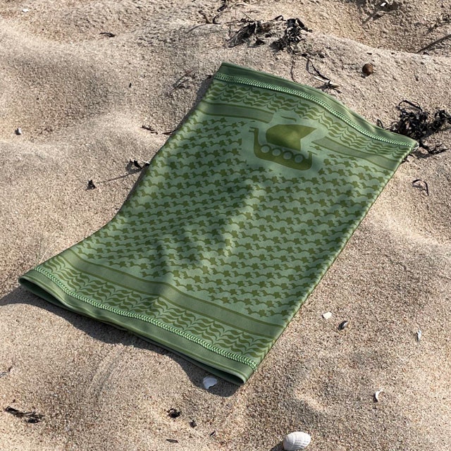 Neck Tube Shemagh Lime Green from TAC-UP GEAR lying flat on sand and seen from a slight angle