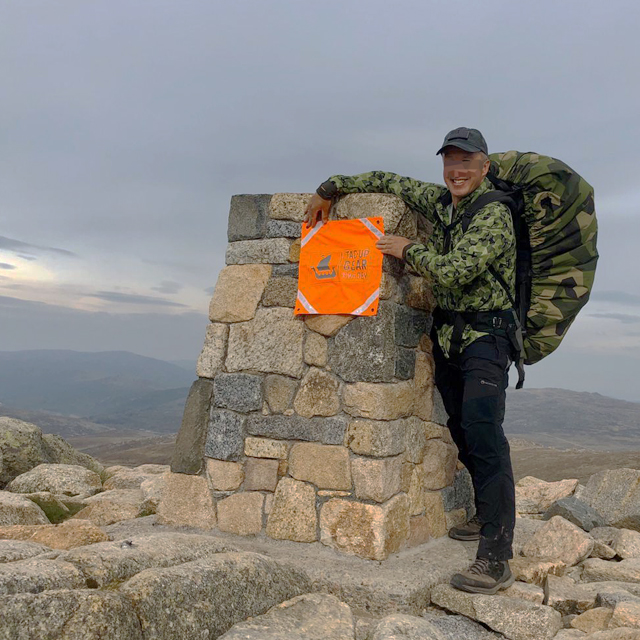 Orange Ruck Signal Panel Marker on the top of Australias highest mountain