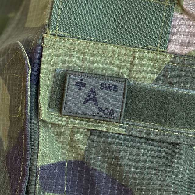 A+ Blood Type Hook Patch Dark Green from TAC-UP GEAR mounted on a Field Shirt M90