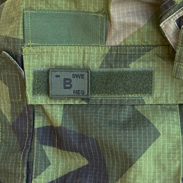 B-/NEG Blood Type Hook Patch Dark Green from TAC-UP GEAR mounted on a Field Shirt M90