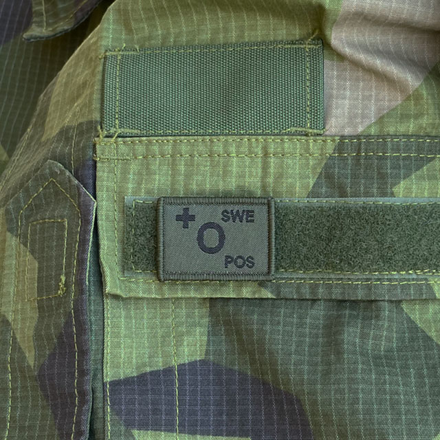 O+ Blood Type Hook Patch Dark Green from TAC-UP GEAR mounted on a Field Shirt M90