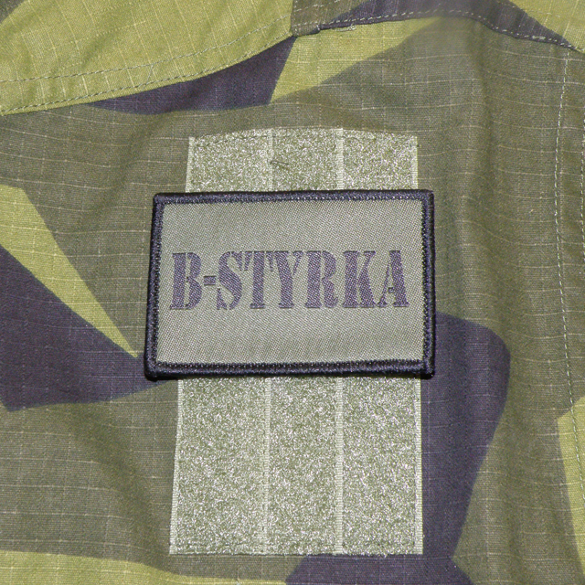 B-Styrka Hook Green Patch mounted on a arm of a M90 jacket.