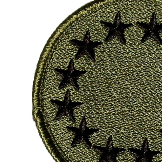 Close up of a EU Green Embroidered Patch.