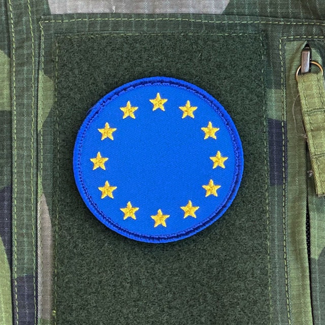 EU Round Blue Hook Patch from TAC-UP GEAR mounted on a M90 Field shirt