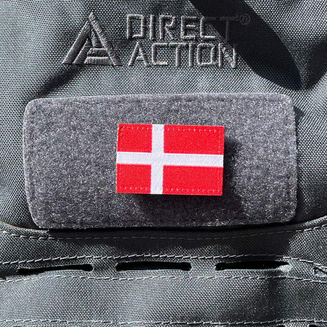 A Denmark Flag Hook Patch Small from TAC-UP GEAR mounted on a grey rucksack