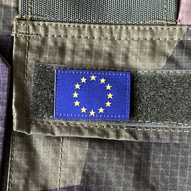 Blue and yellow EU Flag Hook Patch Small from TAC-UP GEAR on a M90 Shirt