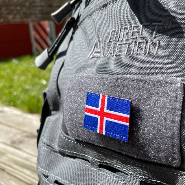 A Iceland Flag Hook Patch Small from TAC-UP GEAR mounted on velcro sleeve on a rucksack seen from an angle