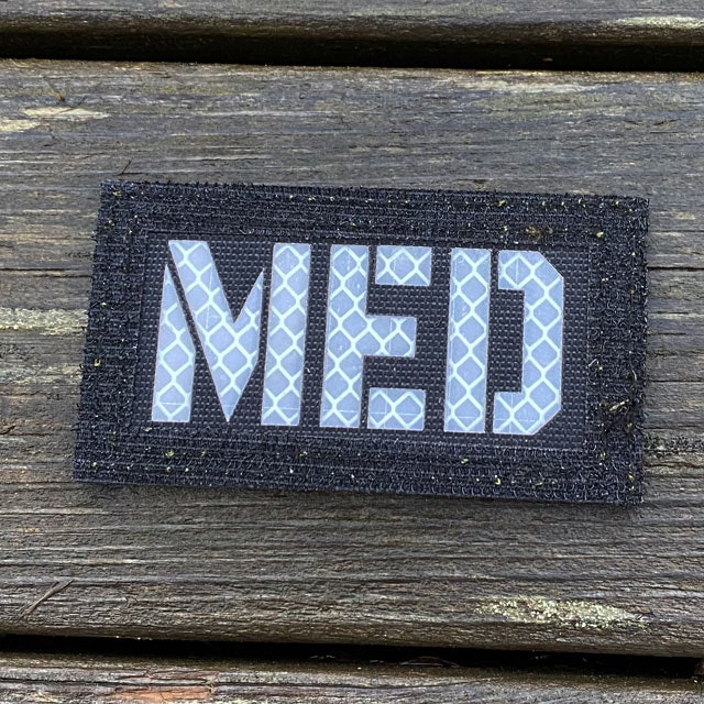 Black side up on a IR - MED Black-Green Reversible Glow Hook Patch