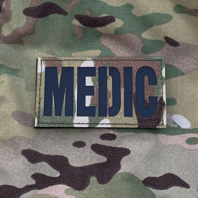 A IR - MEDIC Multicam Hook Patch on a Multicam jacket