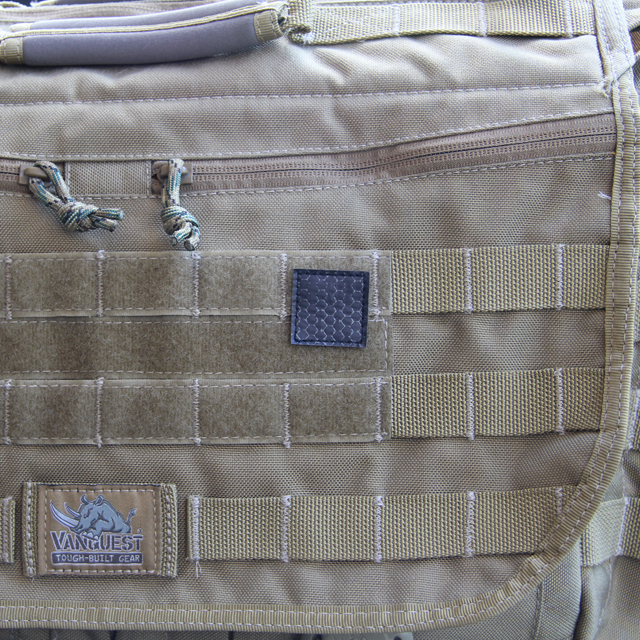 A IR Tactical Glint Square - 3 cm mounted on a messengerbag.