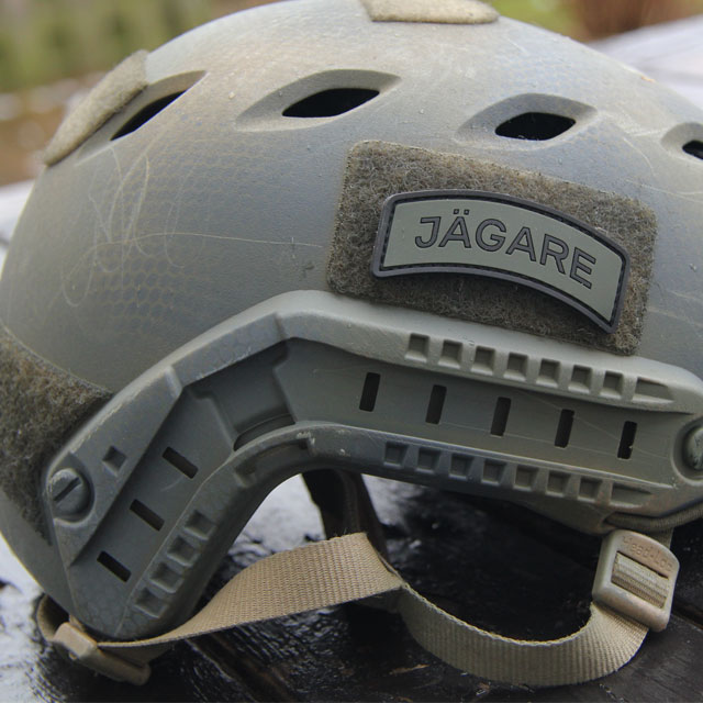 Ops Core helmet and a JÄGARE Black/Green/Black PVC Patch.