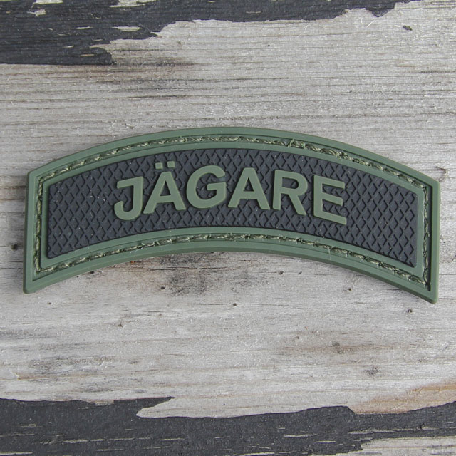 Wood background and JÄGARE Green/Black PVC Patch M15.