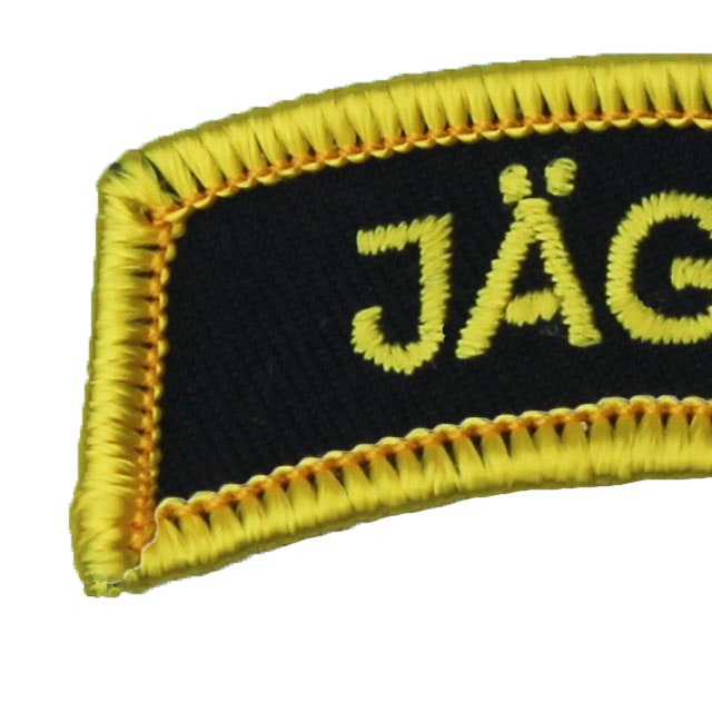 Close up of a JÄGARE Patch Yellow/Black/Yellow.