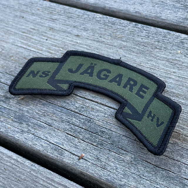 JÄGARE Sew On Scroll Patch seen from an angle