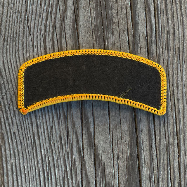 A JÄGARE Sew On Patch Orange/Black from TAC-UP GEAR seen from the back
