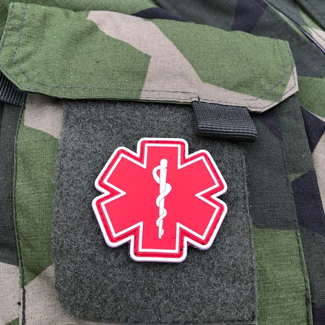 Arm pocket of a NCWR M90 Jacket and a MEDIC PVC Star Red White Hook Patch.