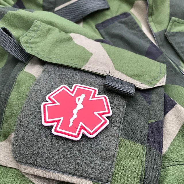 Arm pocket of a NCWR M90 Jacket and a MEDIC PVC Star Red White Hook Patch.