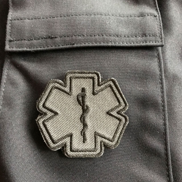 Blue background and a MEDIC Star of Life Black Grey Hook Patch.