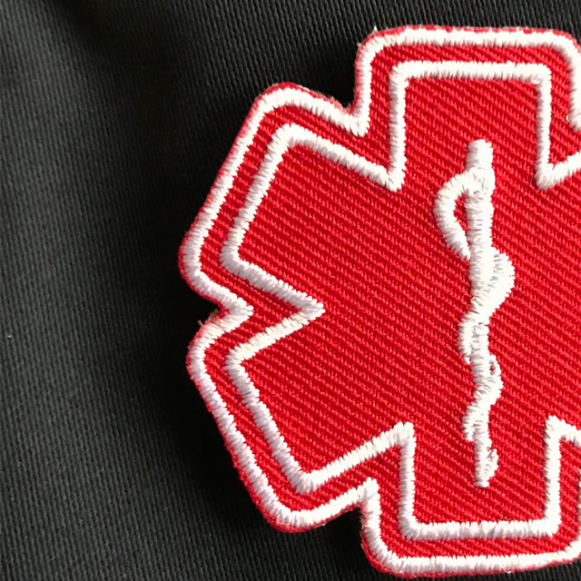 Detailed view of a MEDIC Star of Life Red White Hook Patch.