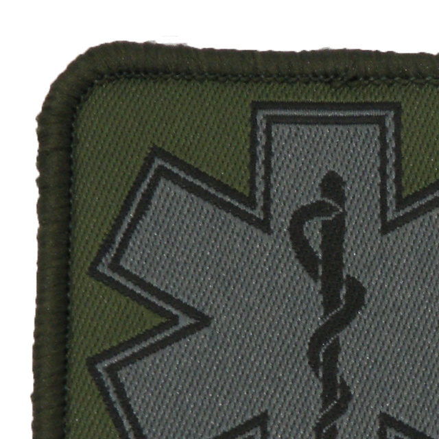 Close up of a MEDIC Subdued Green Star Patch.