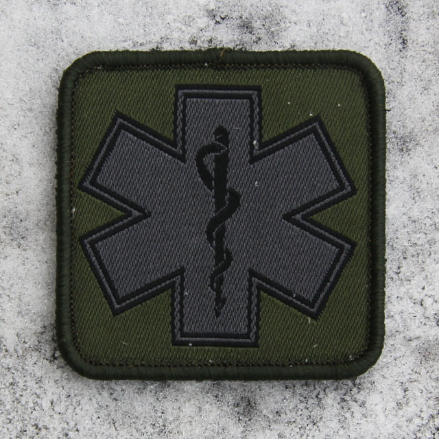 MEDIC Subdued Green Star Patch on frosty background.