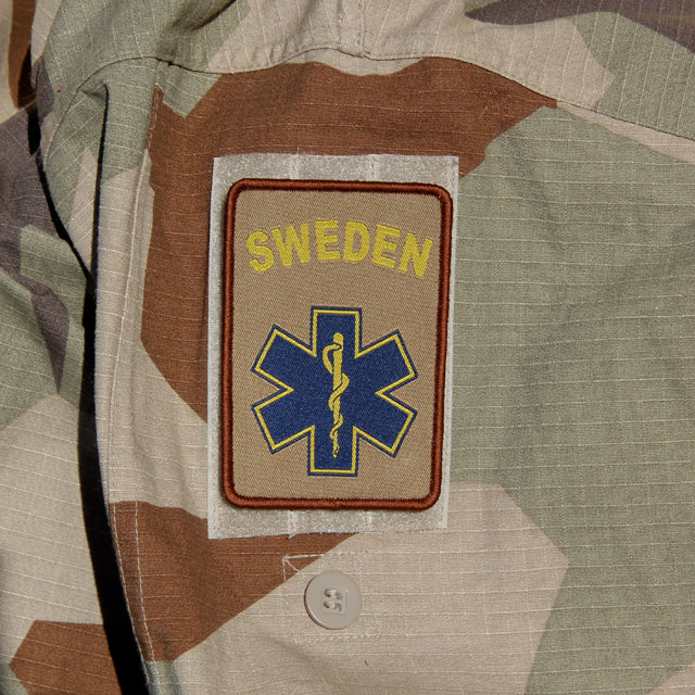 M90K Desert Camouflage background and a SWE MEDIC Desert Star Hook Patch.