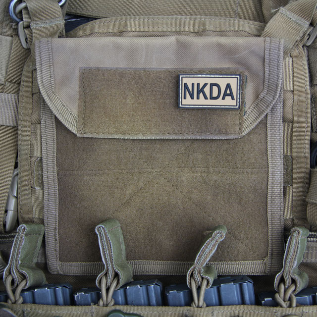 NKDA Desert Hook PVC Patch on a coyote plate carrier