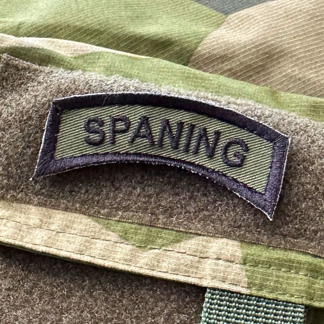 SPANING Tab Hook Patch Black/Green from TAC-UP GEAR mounted on a NCWR jacket M90