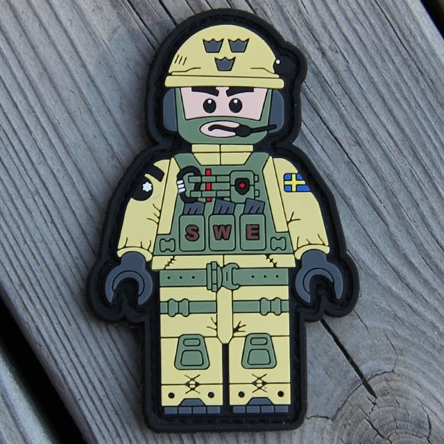 Wooded background for product photo of a SWE SOG PVC Figur Patch.