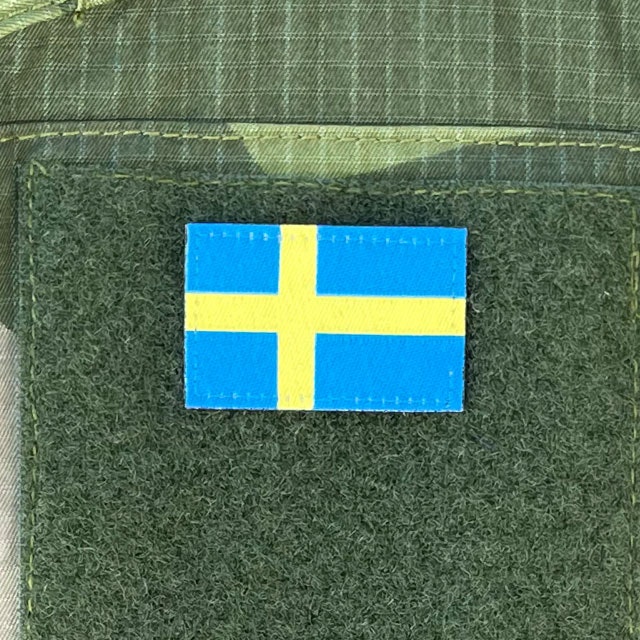 Sweden Flag Hook Patch Arm mounted on green loop on a sleeve