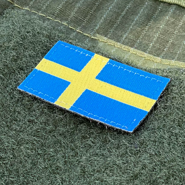 Seen from an angle a Sweden Flag Hook Patch Arm