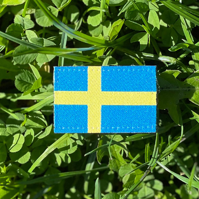 Sweden Flag Hook Patch Arm on the grass