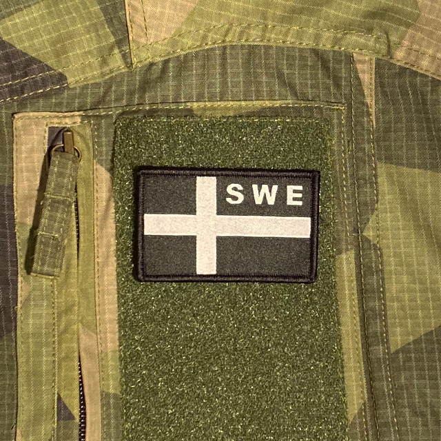 Sweden Flag OPS Black White Patch mounted on a M90 shirt sleeve
