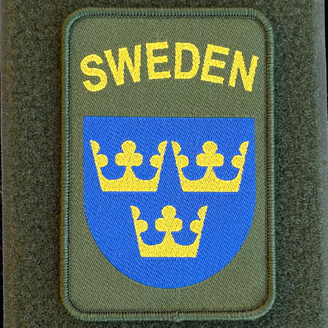 A closer look at a Sweden Hook Patch Green from TAC-UP GEAR on green loop fabric