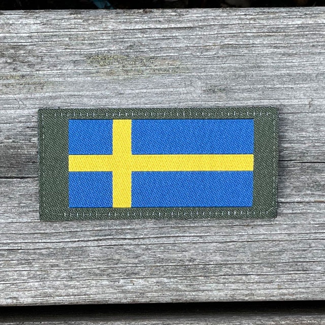 Sweden Long Flag Green from TAC-UP GEAR on a wooden background