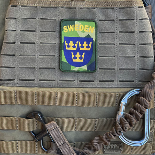 A Sweden Hook Patch M90 from TAC-UP GEAR seen full front mounted on 5.11 plate carrier