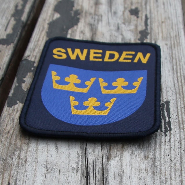 Woody background and a Sweden Hook Patch Navy Blue.