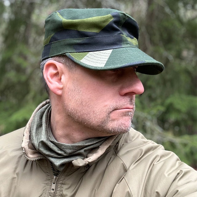 Patrol Cap M90 from TAC-UP GEAR on a model in the Swedish forest