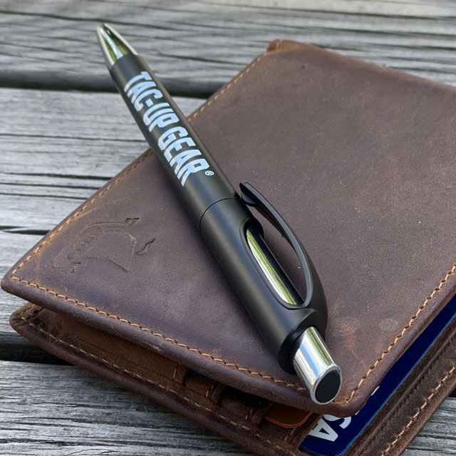 A Pen EDC Black from TAC-UP GEAR lying an a leather wallet