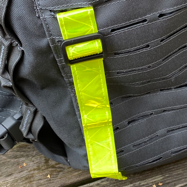 Showing one Reflective Stripe Yellow from the top mounted on a grey rucksack